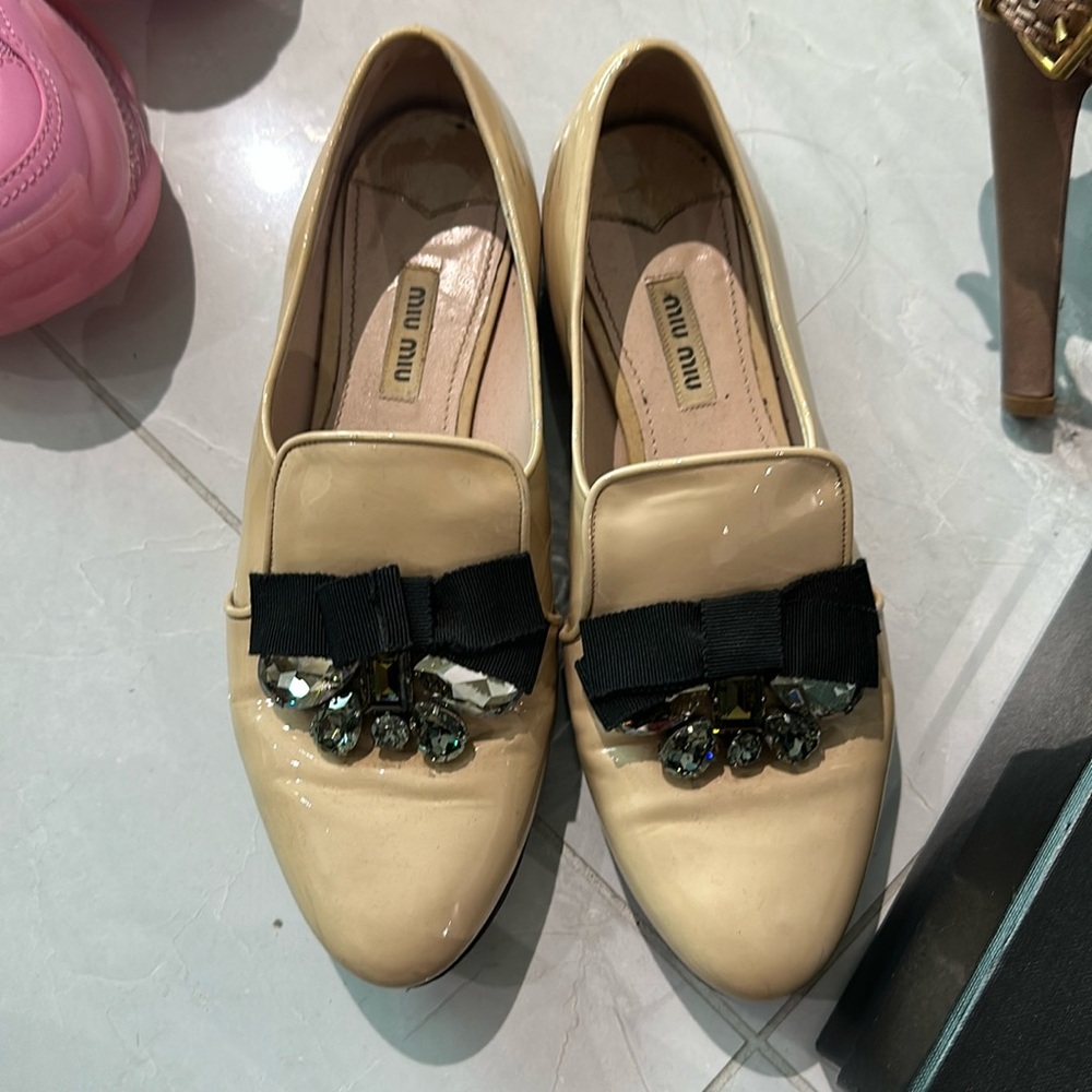 Miu Miu Patent Beige Loafers with Black Grosgrain Bow and Crystal Accents